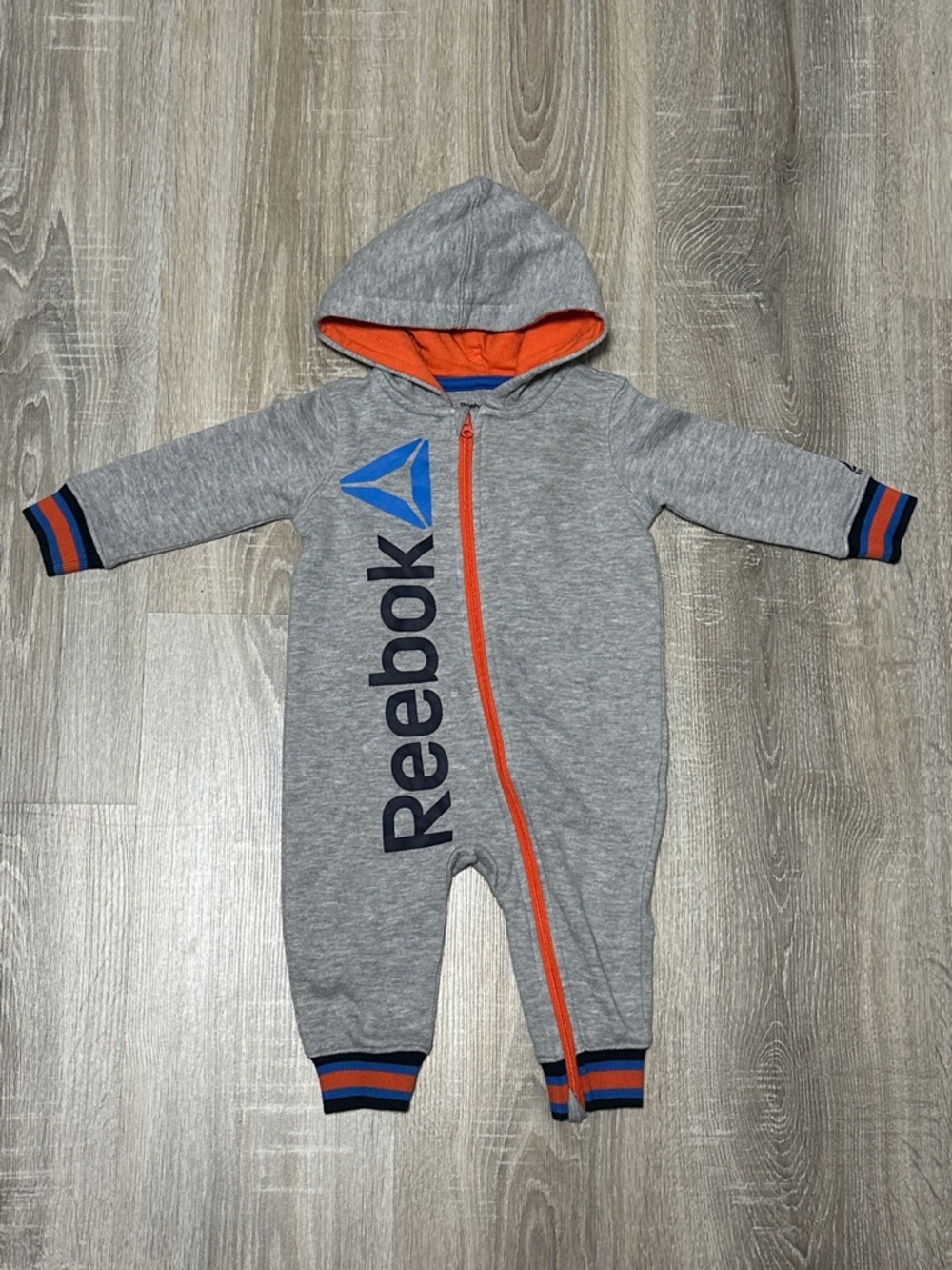 Reebok Gray One-Piece with Orange Trim and Blue Logo